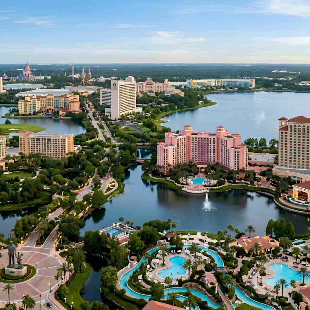 Aerial view of Orlando resort hotels and lakes near Walt Disney World with Cinderella Castle visible in the background